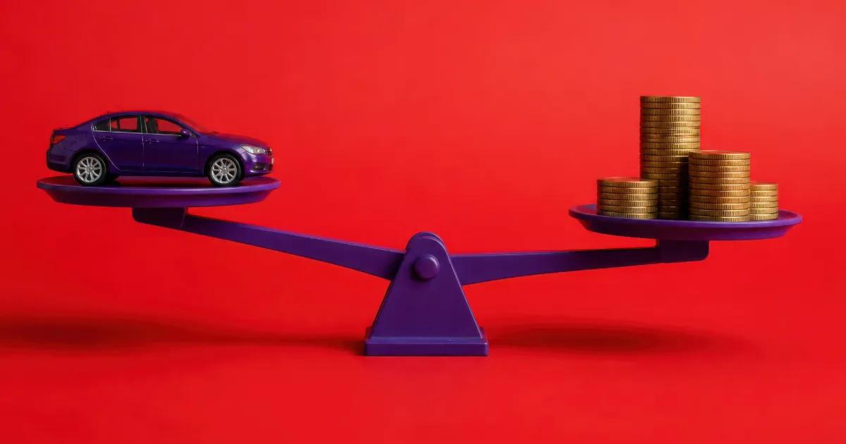 A toy car balanced on a scale against stacks of coins — when impound fees are eating your car's value in Texas