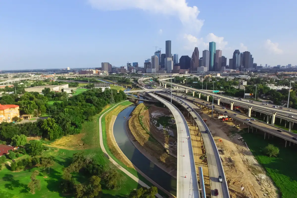 Sell a flood-damaged car in Houston: aerial view of downtown houston and i-45 Aerial view of downtown Houston and I-45, the area where many owners sell a flood-damaged car in Houston