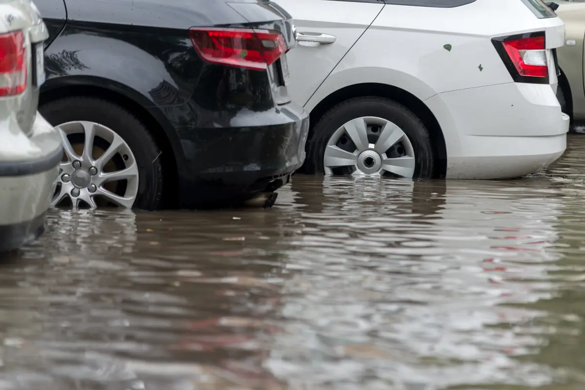 Cars sitting in floodwater after heavy rain, the situation car insurance flood damage coverage is for