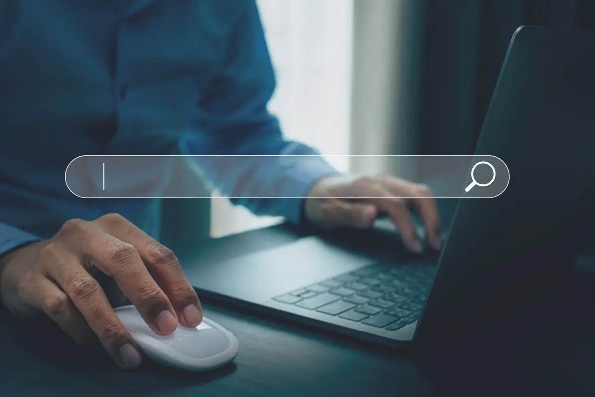 Cash for cars in Texas: hands on a laptop with a blank search bar Hands on a laptop with a blank search bar, how sellers search for cash for cars in Texas
