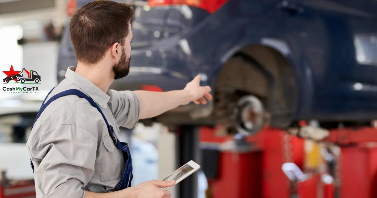 A mechanic inspecting a car on a lift with a tablet — when a repair quote costs more than your car in Texas, CashMyCarTX