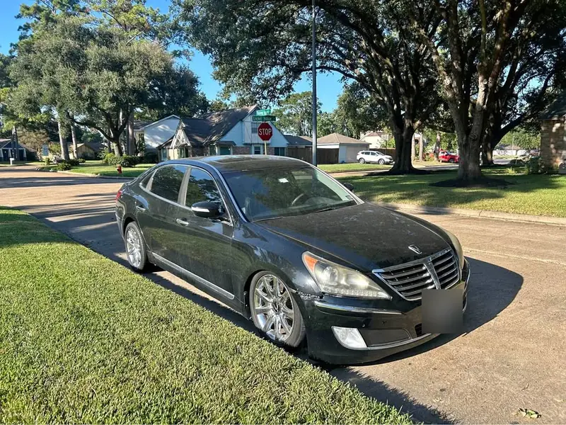 Black 2011 Hyundai Equus Signature junk car bought for $2,000 in Corpus Christi, TX. Luxury sedan with cosmetic wear.