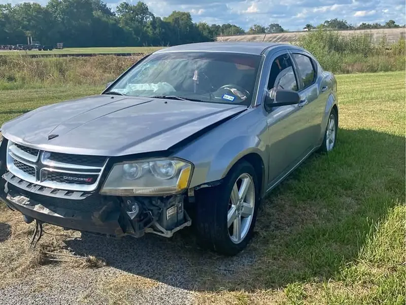 Silver 2013 Dodge Avenger junk car bought for $700 in Baytown, TX. Front-end crash, airbags deployed.