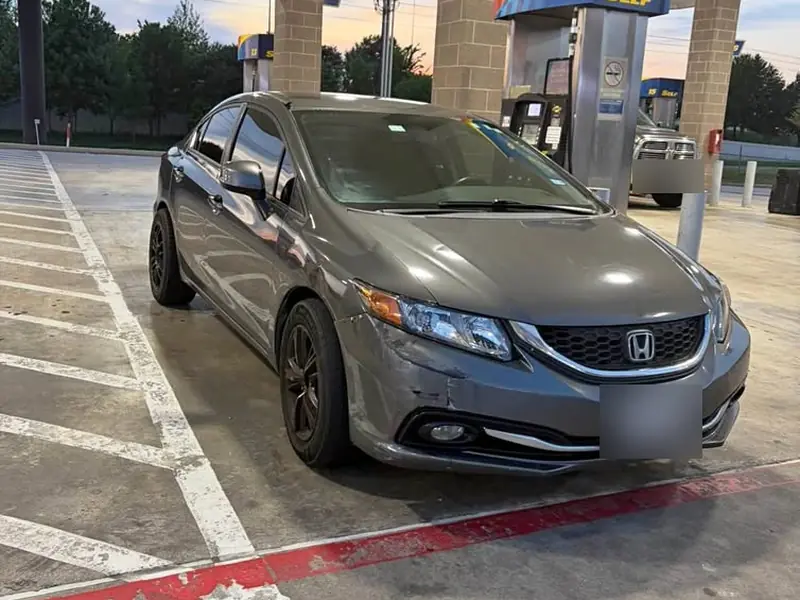 Gray 2013 Honda Civic DX junk car bought for $3,600 in Houston, TX. Front bumper scrape.